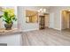 Open living space with wood floors, cabinet, chandelier, and view to the hall at 444 Silverbell Ct, Peachtree City, GA 30269