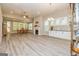 Open-concept living room featuring a fireplace, built-in cabinets, and wood flooring at 444 Silverbell Ct, Peachtree City, GA 30269
