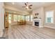 Spacious living area with fireplace, windows with shutters, and a dining table at 444 Silverbell Ct, Peachtree City, GA 30269
