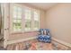 Cozy living space featuring natural light from the windows and a comfortable chair at 444 Silverbell Ct, Peachtree City, GA 30269