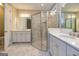 Stylish main bathroom featuring double sinks, white cabinetry, and an elegant glass shower at 444 Silverbell Ct, Peachtree City, GA 30269