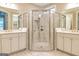 Stunning main bathroom boasting double vanities, and a glass enclosed shower with marble tile at 444 Silverbell Ct, Peachtree City, GA 30269