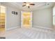 Spacious main bedroom featuring tray ceilings, neutral tones, and an ensuite bathroom at 444 Silverbell Ct, Peachtree City, GA 30269