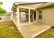 Covered patio featuring a concrete floor, natural light, and access to the home's rear entrance at 444 Silverbell Ct, Peachtree City, GA 30269