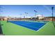 Well-maintained tennis court on a clear day, perfect for an active lifestyle at 444 Silverbell Ct, Peachtree City, GA 30269