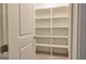 This large walk-in closet features built-in shelving, perfect for organizing clothes and accessories at 444 Silverbell Ct, Peachtree City, GA 30269