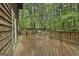 Spacious wooden deck with outdoor seating and lush green surroundings at 101 Longer Dr, Peachtree City, GA 30269