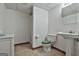 Basement bathroom featuring a white vanity, toilet with decorative seat, and tiled flooring at 101 Longer Dr, Peachtree City, GA 30269