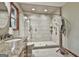 Modern bathroom with a walk-in shower, granite counters and updated fixtures at 101 Longer Dr, Peachtree City, GA 30269