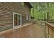Spacious wooden deck with sliding glass door and outdoor seating at 101 Longer Dr, Peachtree City, GA 30269