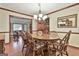 Traditional dining room with wood floors and wainscoting, showcasing an oval table and chairs at 101 Longer Dr, Peachtree City, GA 30269