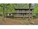 Charming two-story home featuring a double balcony and lush, mature landscaping at 101 Longer Dr, Peachtree City, GA 30269