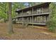 Charming two-story home featuring a double balcony and lush, mature landscaping at 101 Longer Dr, Peachtree City, GA 30269