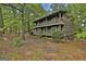 Charming two-story home featuring a double balcony and lush, mature landscaping at 101 Longer Dr, Peachtree City, GA 30269
