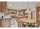 Spacious kitchen with granite countertops, stainless steel appliances, and central island with barstool seating at 101 Longer Dr, Peachtree City, GA 30269
