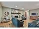 Charming living room with a stone fireplace, hardwood floors, and comfortable green leather furniture at 101 Longer Dr, Peachtree City, GA 30269