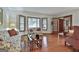 Bright living room featuring hardwood floors and a bay window, furnished with patterned sofas at 101 Longer Dr, Peachtree City, GA 30269