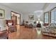 Bright living room boasting hardwood floors, a bay window, and classic decor at 101 Longer Dr, Peachtree City, GA 30269