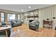 Inviting living room featuring a stone fireplace, hardwood floors, and comfortable seating at 101 Longer Dr, Peachtree City, GA 30269