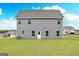 Rear exterior of home with large yard at 235 Oliver Dr, Locust Grove, GA 30248