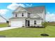 Beautiful home with a well-maintained lawn and attractive landscaping at 235 Oliver Dr, Locust Grove, GA 30248