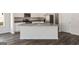 Modern kitchen island with stainless steel appliances, granite countertops, and white cabinets, perfect for entertaining at 453 Prescott Way, Villa Rica, GA 30180