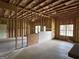 Unfinished basement shows the framing and insulation of the space at 6504 Cedar Mountain Rd, Douglasville, GA 30134