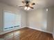 Comfortable bedroom with a ceiling fan and a window looking onto the front yard at 6504 Cedar Mountain Rd, Douglasville, GA 30134