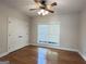 Bedroom has hardwood floors, a ceiling fan, and a window to the front yard at 6504 Cedar Mountain Rd, Douglasville, GA 30134