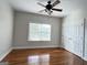 Comfortable bedroom with a ceiling fan and a window looking onto the front yard at 6504 Cedar Mountain Rd, Douglasville, GA 30134