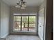 Bright dining area with a view of the outdoor deck and backyard, offering a charming space for meals at 6504 Cedar Mountain Rd, Douglasville, GA 30134