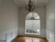 Elegant dining room featuring a large window, chandelier lighting and wainscoting details at 6504 Cedar Mountain Rd, Douglasville, GA 30134