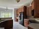 Well-equipped kitchen featuring wooden cabinetry, modern appliances, and a functional layout at 6504 Cedar Mountain Rd, Douglasville, GA 30134