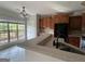 Spacious kitchen featuring a breakfast bar, tile backsplash, and modern appliances for convenient cooking at 6504 Cedar Mountain Rd, Douglasville, GA 30134