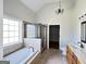 Large main bathroom has separate shower and bathtub with a chandelier hanging above the bathtub at 6504 Cedar Mountain Rd, Douglasville, GA 30134