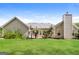 View of the house backyard featuring well-kept green grass and small palm trees at 121 Crestwood Ct, Hampton, GA 30228
