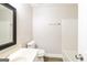 Clean bathroom featuring a vanity with a white countertop, toilet, mirror, and shower over tub at 121 Crestwood Ct, Hampton, GA 30228
