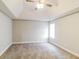An empty primary bedroom with a ceiling fan and a window at 121 Crestwood Ct, Hampton, GA 30228