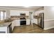 Modern kitchen with stainless steel appliances and granite countertops at 121 Crestwood Ct, Hampton, GA 30228
