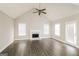 Bright living room featuring a fireplace, wood floors, and natural light at 121 Crestwood Ct, Hampton, GA 30228