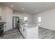 Kitchen featuring a large island with granite countertops and stainless steel appliances at 455 Prescott Way, Villa Rica, GA 30180