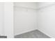 Walk-in closet offers wire shelving and neutral carpeting at 455 Prescott Way, Villa Rica, GA 30180