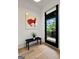Stylish entryway featuring sleek bench seating, modern art, and a glass door to the outside at 300 Mado Ln # 329, Chattahoochee Hills, GA 30268