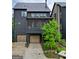 Contemporary home features a two-car garage and a screened-in porch at 300 Mado Ln # 329, Chattahoochee Hills, GA 30268