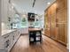 Bright kitchen with white cabinetry, light wood floors, and a center island with butcher block countertop at 300 Mado Ln # 329, Chattahoochee Hills, GA 30268