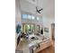 Bright, modern living room with soaring ceilings, fireplace, and access to a private patio at 300 Mado Ln # 329, Chattahoochee Hills, GA 30268