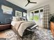 Comfortable main bedroom featuring an oversized window for natural light and modern finishes at 300 Mado Ln # 329, Chattahoochee Hills, GA 30268