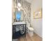Stylish powder room with chevron accent wall, modern fixtures, and attractive design at 300 Mado Ln # 329, Chattahoochee Hills, GA 30268