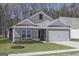 Charming one-story home with gray siding, a manicured lawn, and an attached two-car garage at 451 Prescott Way, Villa Rica, GA 30180