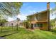 A fenced backyard featuring a lush green lawn, brick patio and exterior home view at 3913 Landgraf Cv, Decatur, GA 30034